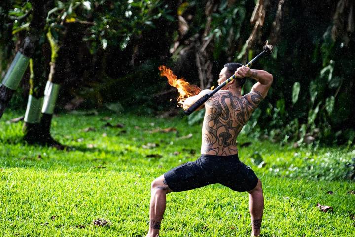a man throwing a frisbee at the park
