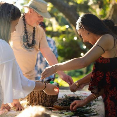a woman cutting a cake