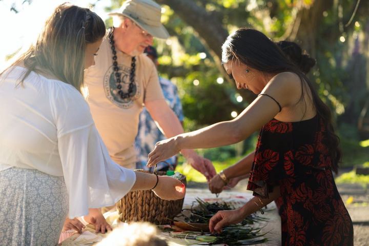 a woman cutting a cake
