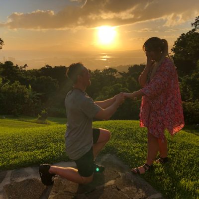 a couple of people that are standing in the grass