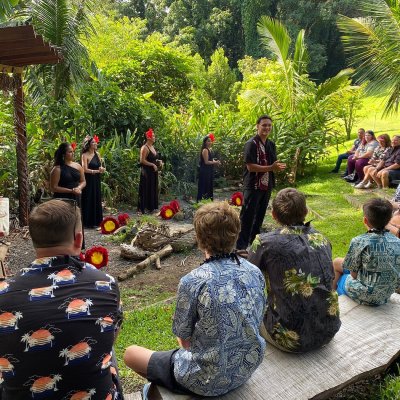 a group of people standing in a garden