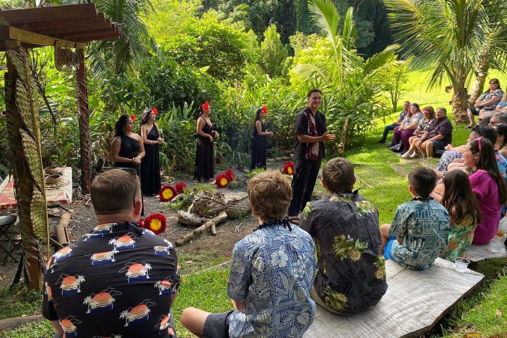 a group of people standing in a garden