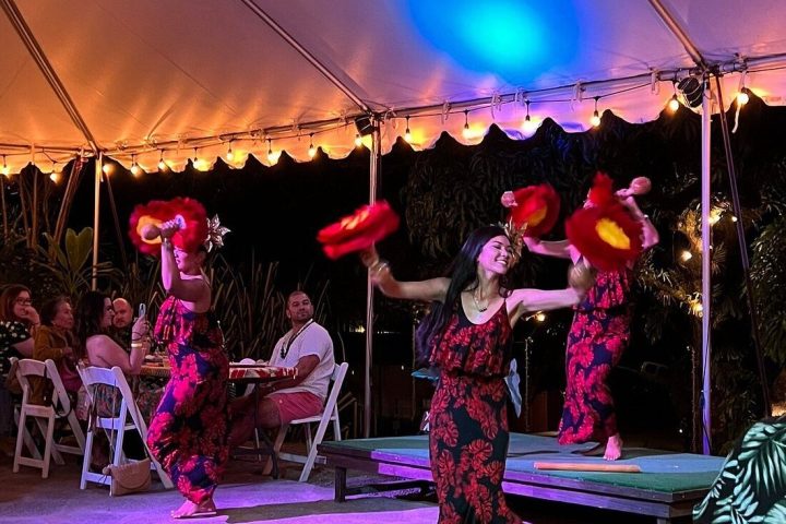 a group of people on a stage in front of a crowd
