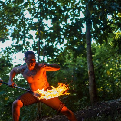 a man holding an orange frisbee