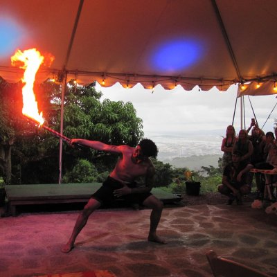 a group of people sitting around a fire